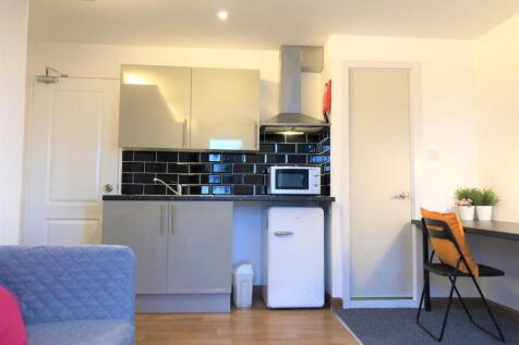 Bright and modern kitchen area featuring sleek ...