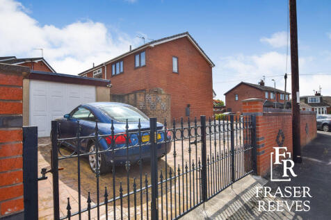 SIDE DRIVEWAY AND GARAGE