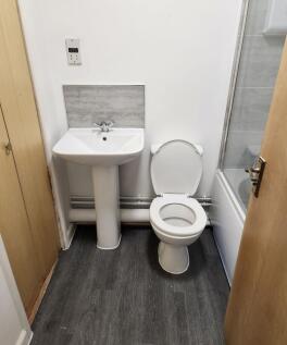 Bright bathroom with contemporary white fixture...