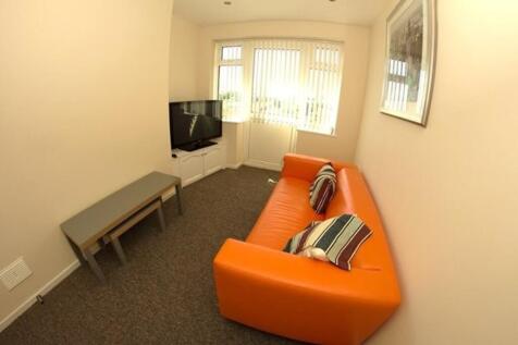 A bright and inviting living room featuring sty...