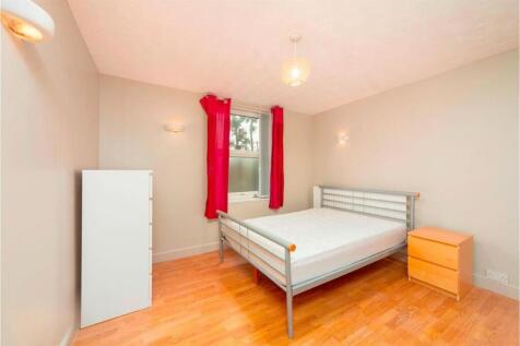 Bright double bedroom with simple furnishings...