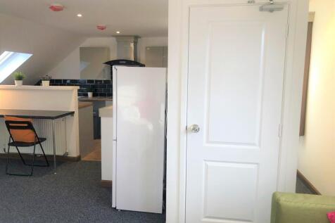 Bright and modern kitchen area featuring a clea...