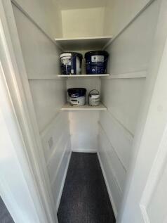 Useful built-in storage closet with shelving...