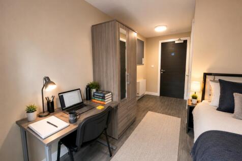 Modern study area and comfy bed in stylish room...