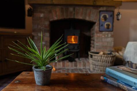 Cosy up by the log burner in the snug