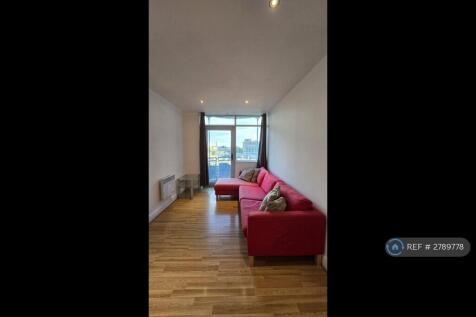 Living Room Open To a Large South Facing Balcony 