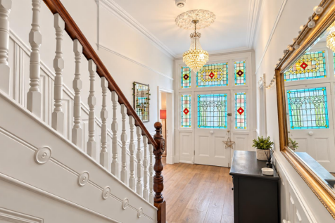 Victorian Hallway with Stained Glass Door.png