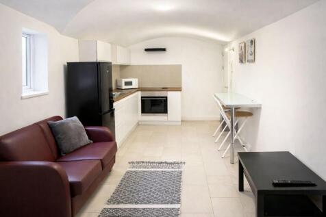 Bright, modern open-plan living area with a com...
