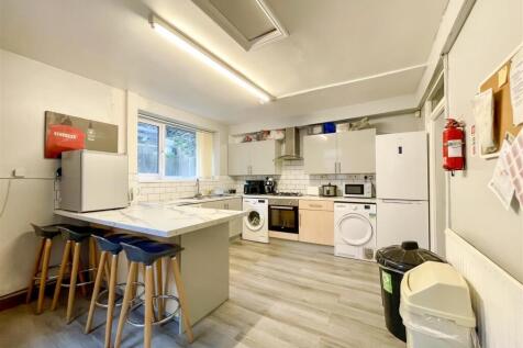 Bright kitchen with breakfast bar and appliance...