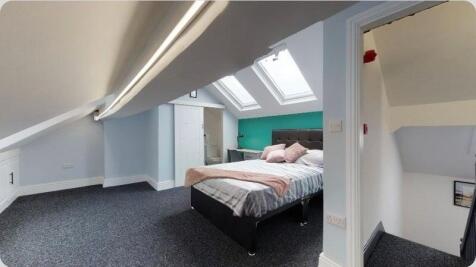 Bright attic bedroom with ensuite and skylights...