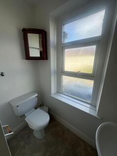 Bright bathroom with large privacy window...
