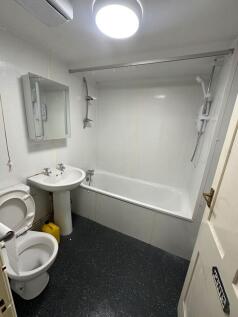 Bright bathroom with a full-length bathtub....