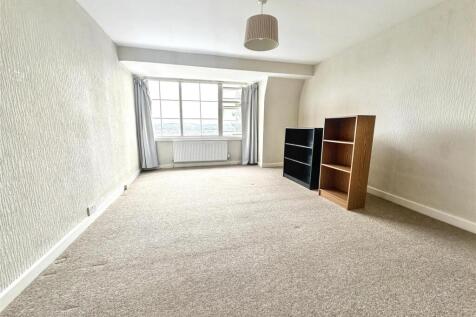 Bright, spacious room with large windows....