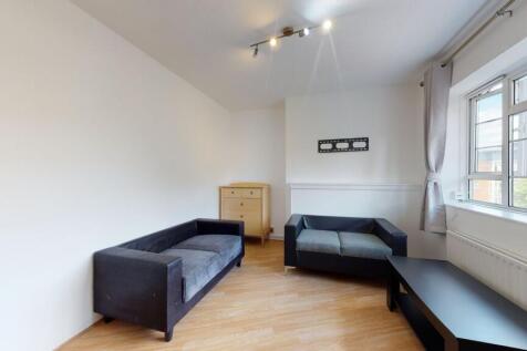 Bright lounge with comfy sofas and wood floors...