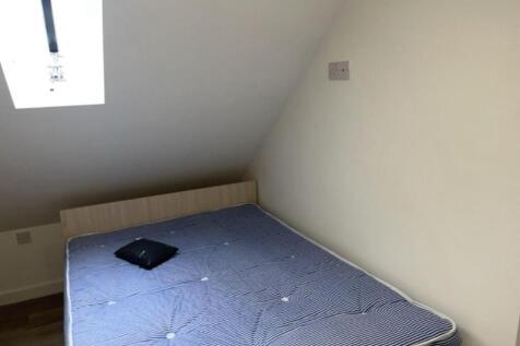 Bright loft bedroom with a comfortable double b...