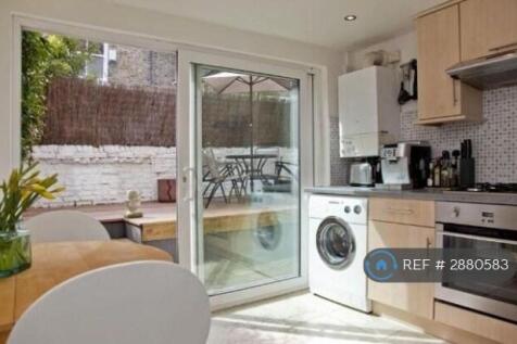 Kitchen With Sliding Door To Private Garden