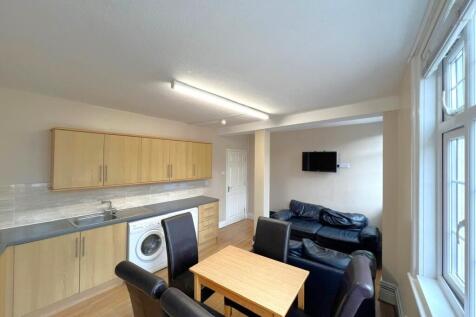 A bright and well-maintained living room featur...