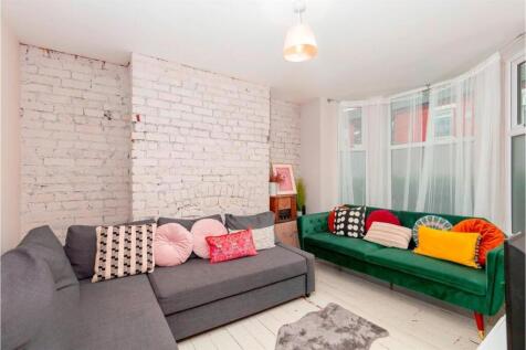 Bright and stylish living room with comfy sofas...