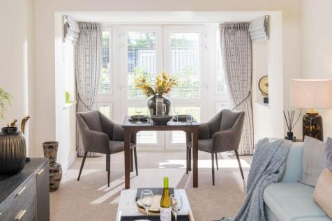 a living room with a table and chairs