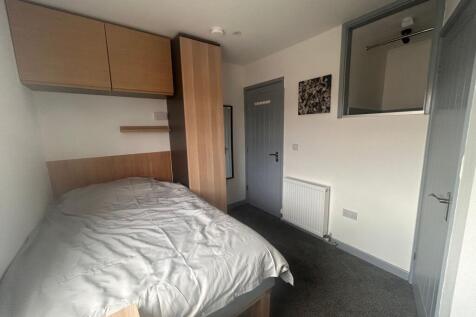 Neat single bedroom with built-in storage...