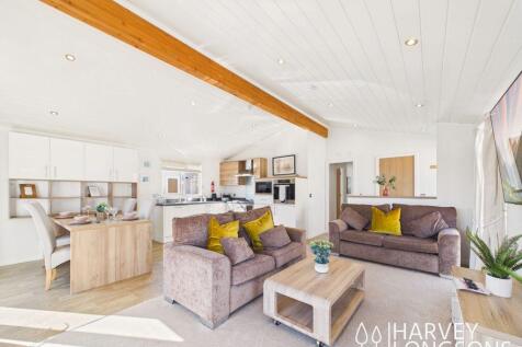 Open plan lounge and kitchen area inside Cambrian 