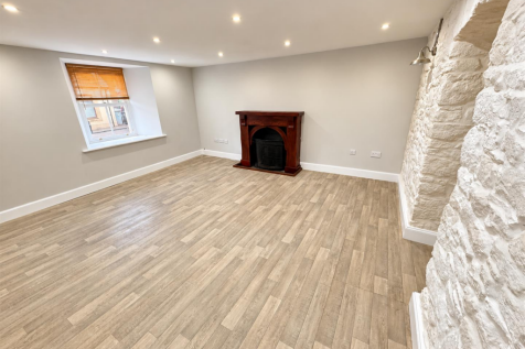 Renovated Living Room with Stone Accent.png