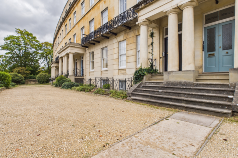 Stone building, clear gravel forecourt