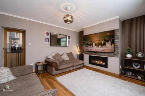Contemporary living room with fireplace.jpg
