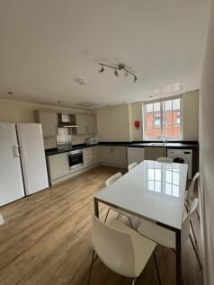 Bright shared kitchen with modern fitted units,...