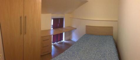 Compact, neatly presented bedroom with built-in...