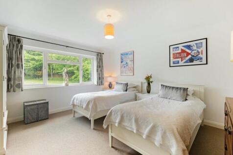 Bedroom three with serene garden outlook