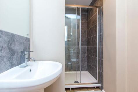 Contemporary bathroom featuring a clean white b...