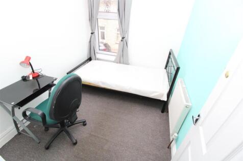 Bright bedroom with a dedicated study desk....