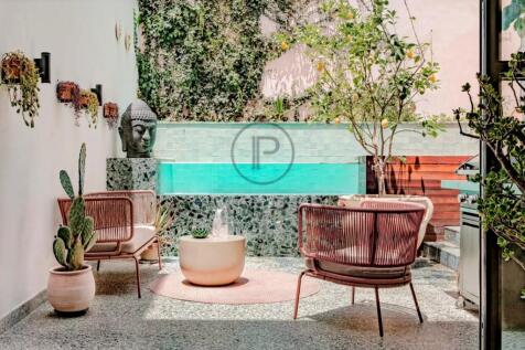 Charming outdoor patio with stylish seating and a 