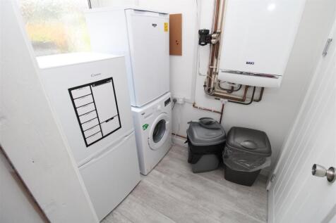 Bright and functional utility room with storage...
