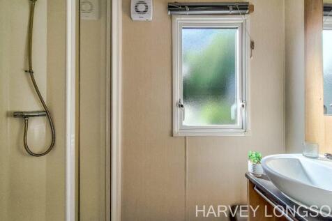 Shower room with wash basin and window
