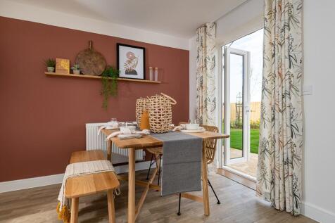 An open plan kitchen dining area is designed for sociable living