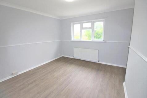 Bright and airy room with modern wood flooring...