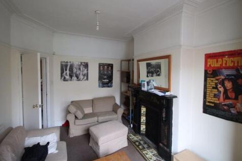 A spacious and well-maintained living room feat...
