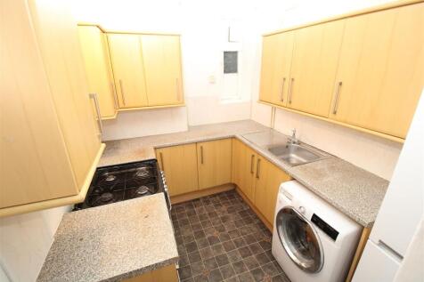 Bright kitchen with ample storage and appliance...