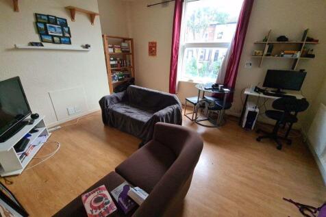 A cozy and well-maintained living room featurin...