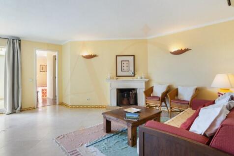 Spacious living room with fireplace and terrace