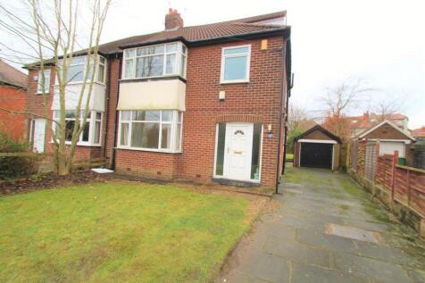 Brick semi¿detached house with a neat front law...