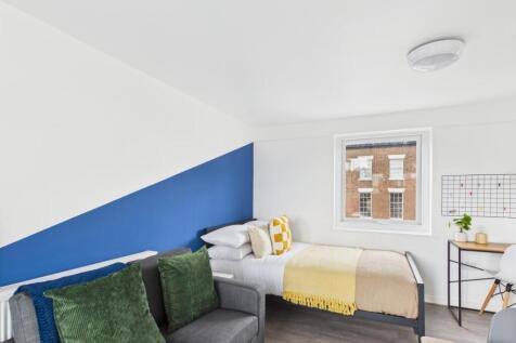 Bright, modern bedroom with a comfortable doubl...