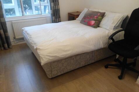 Bright bedroom with double bed and large window...