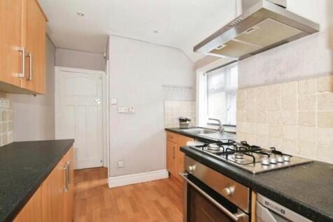 This charming kitchen features modern appliance...