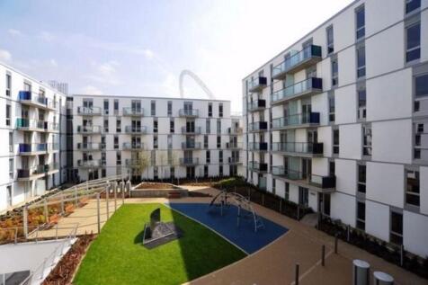 Modern apartment complex with sunny courtyard...