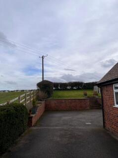 Parking at the rear of the property and terraced garden