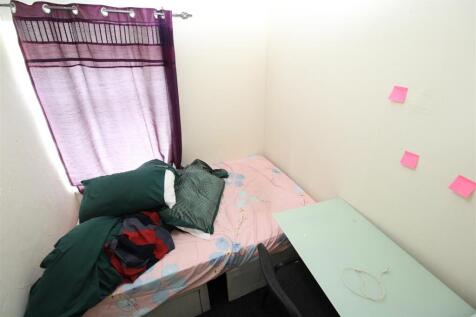 Bright bedroom with desk and natural light...