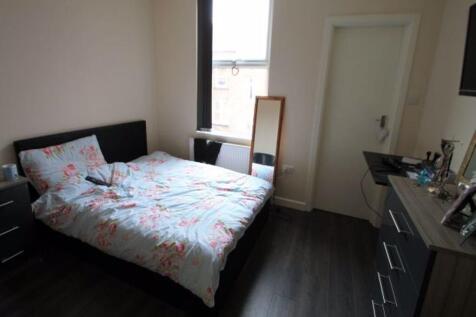 A spacious and well-maintained master bedroom f...